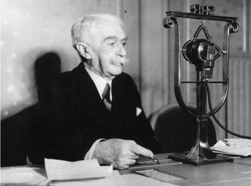 02-Pierre-de-Coubertin-in-the-Radio-Suisse-Romande-studio-IOC-Archives-1112x824px